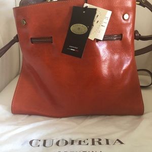 Cuoieria orange handbag.